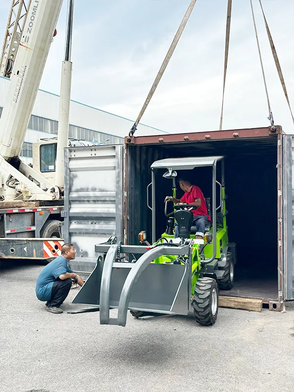 Compact loader moving through a container doorway